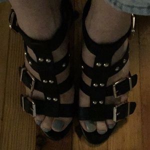 Black leather BCBGeneration sandals.